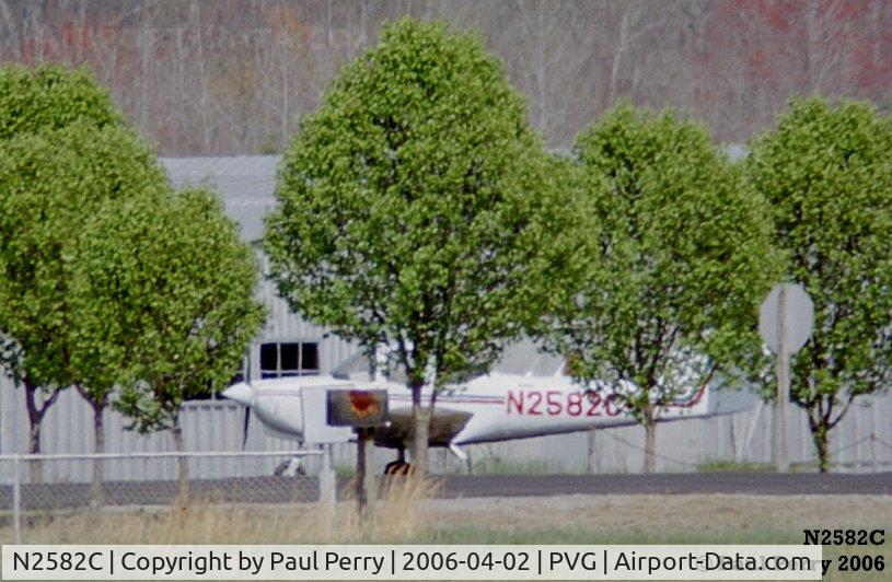 N2582C, 1978 Piper PA-38-112 Tomahawk C/N 38-79A0242, On the roadway between hangars, and partially obscured by the flora