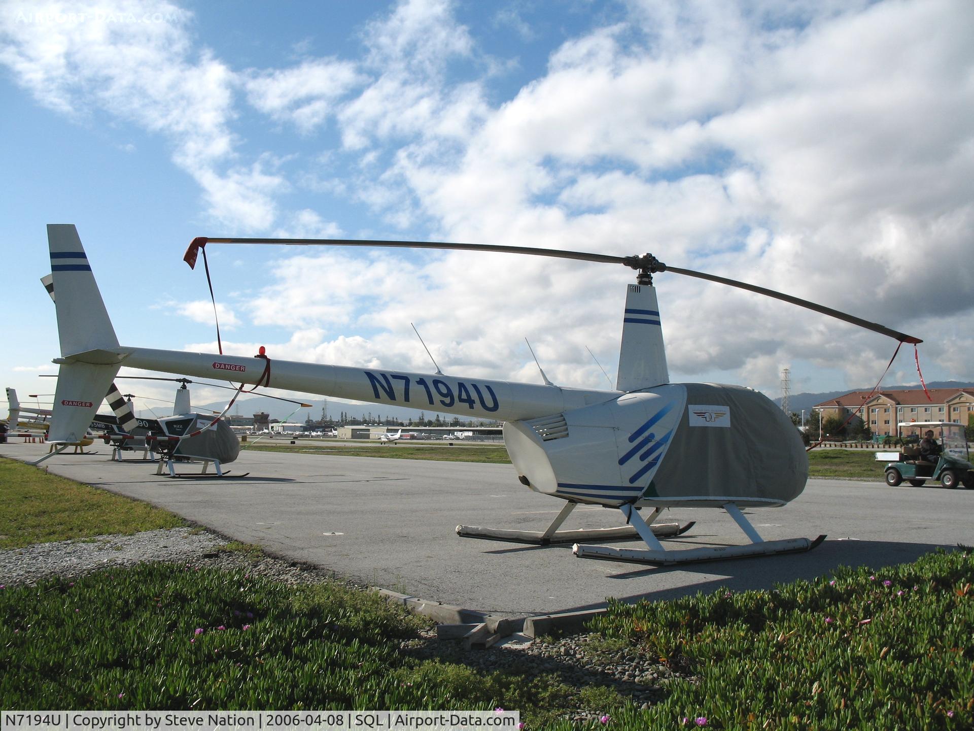 N7194U, 2001 Robinson R44 C/N 0975, Felicty Air 2001 Robinson R44 under wraps @ San Carlos Airport, CA in rare spring 2006 sunshine