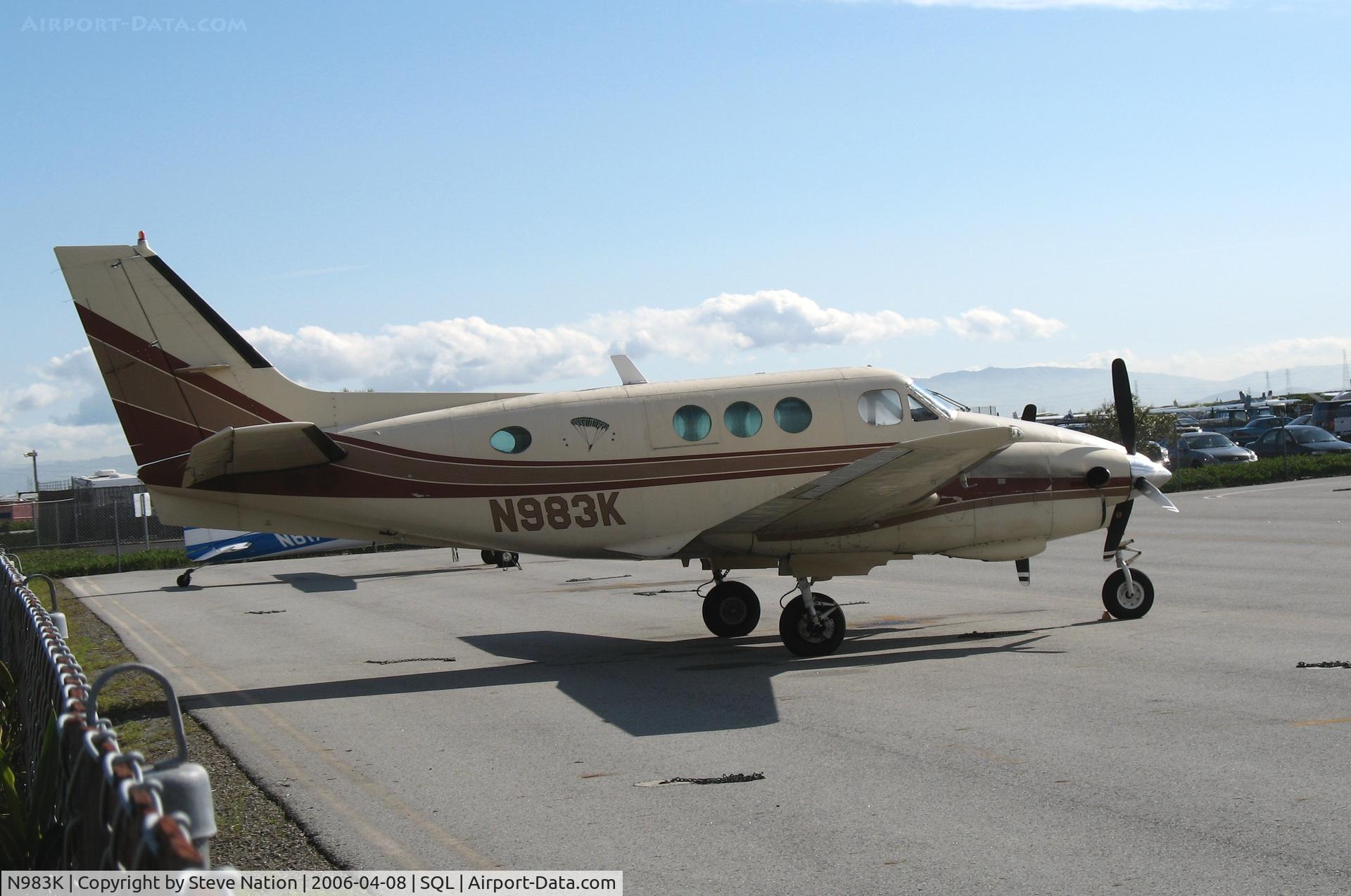 N983K, 1966 Beech 65-A90 C/N LJ-169, skydiving-equipped 1966 Beech 65-A90 King Air w/parachute logo @ San Carlos Airport, CA in rare spring 2006 sunshine