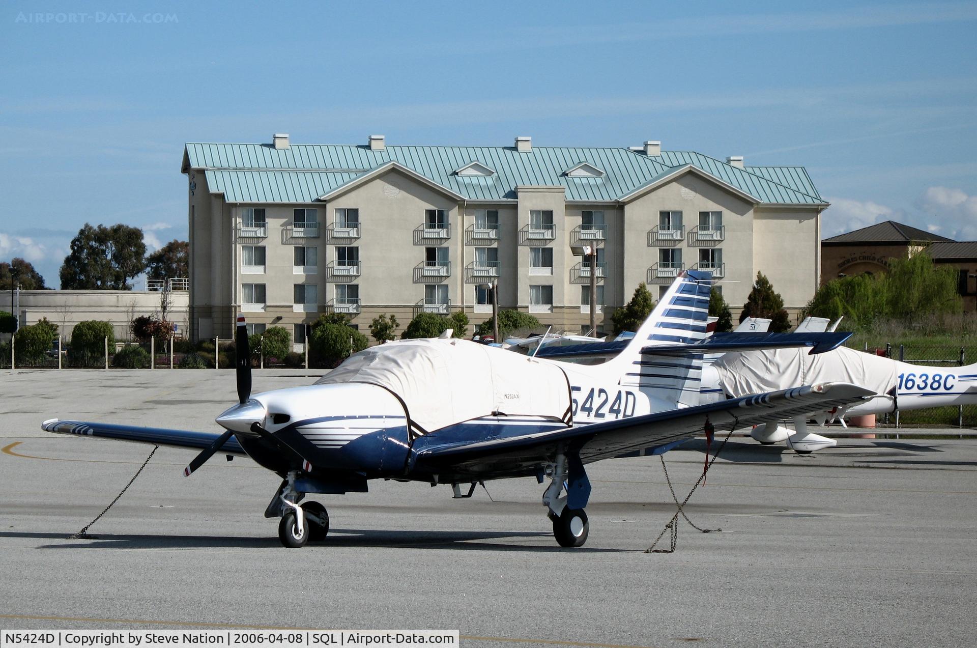 N5424D, 2000 Rockwell Commander 114TC C/N 20028, 2000 Commander Aircraft 114TC under wraps @ San Carlos Airport, CA in rare spring 2006 sunshine