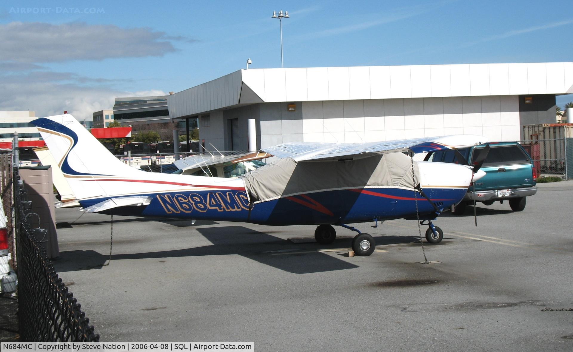 N684MC, Cessna T210M Turbo Centurion C/N 21061604, 1976 Cessna T210M under wraps @ San Carlos Airport, CA in rare spring 2006 sunshine