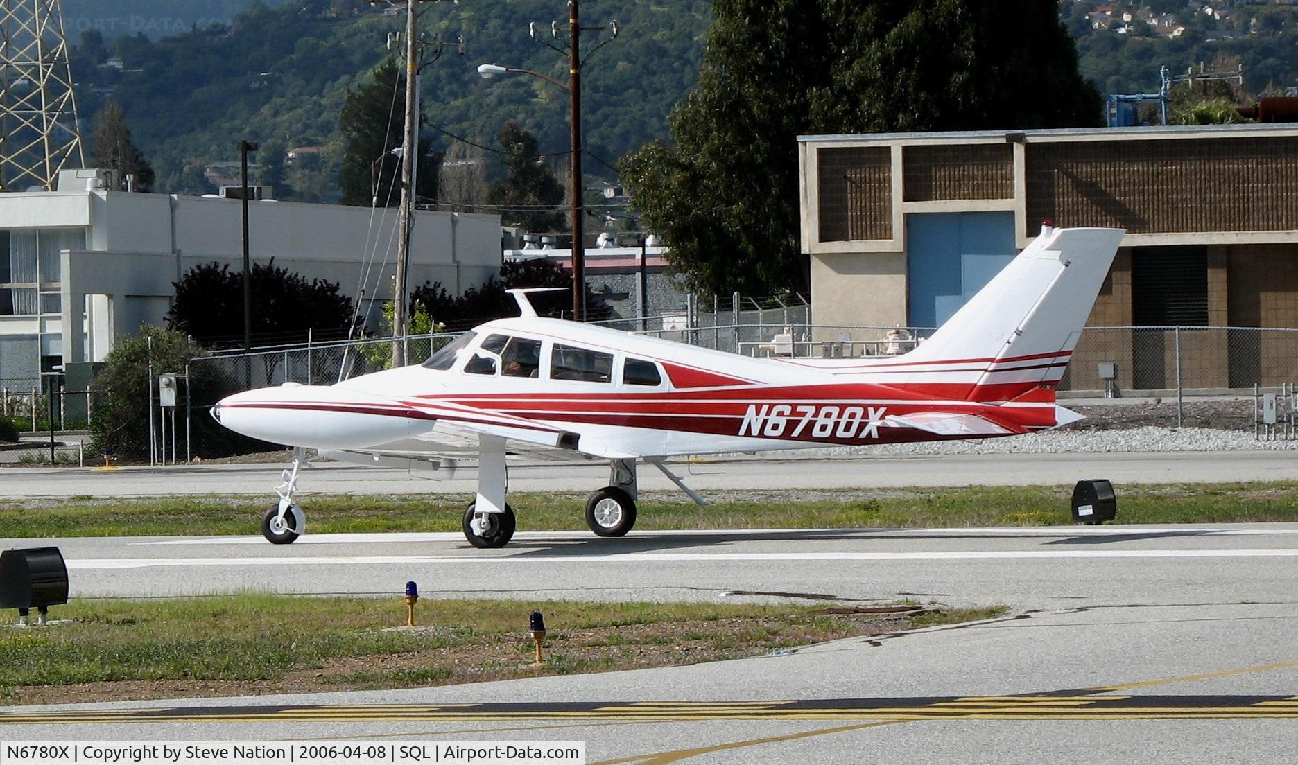 N6780X, 1961 Cessna 310F C/N 310-0080, 1961 Cessan 310F rolling @ San Carlos Airport, CA in rare spring 2006 sunshine