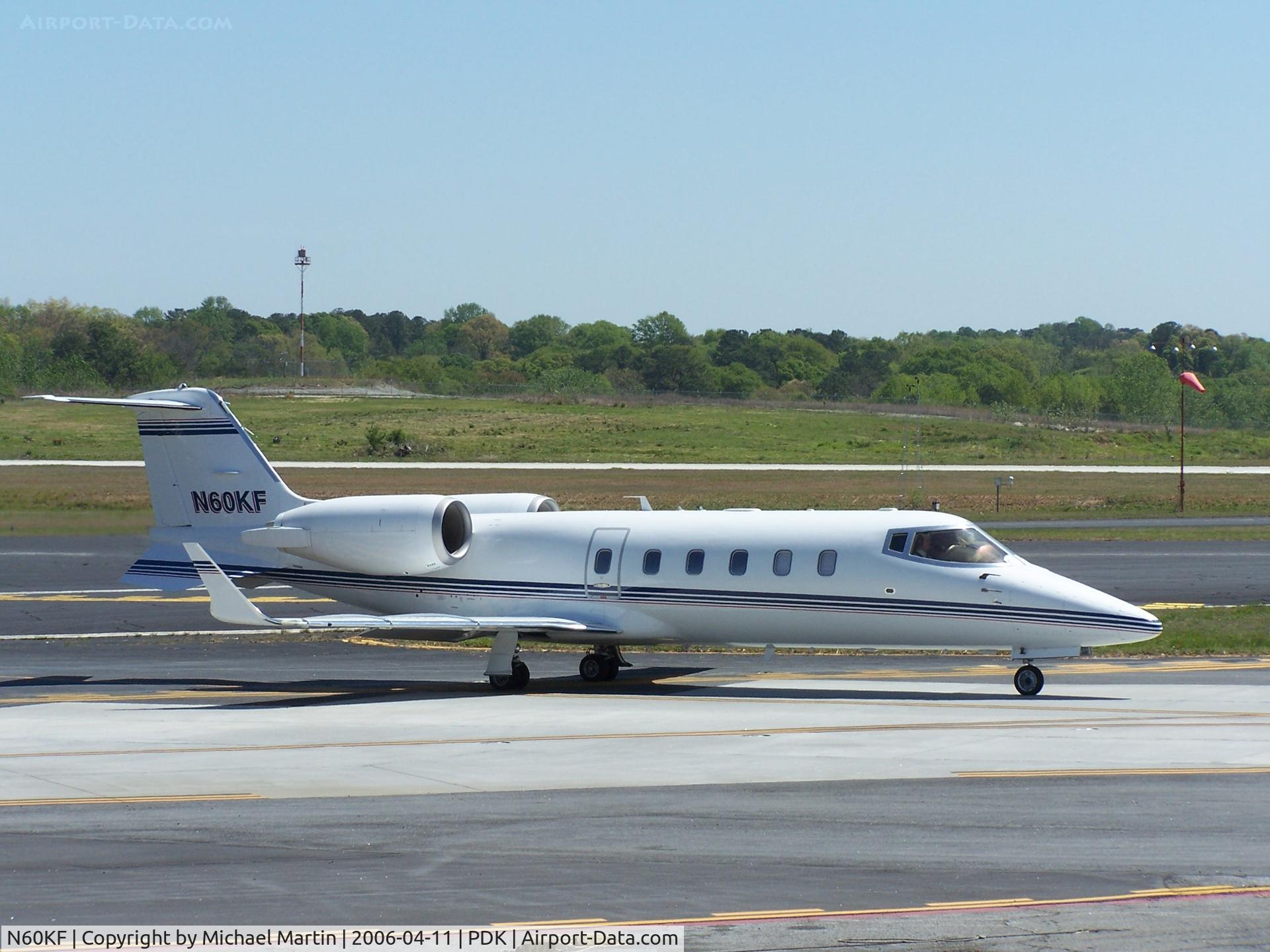 N60KF, 1995 Learjet 60 C/N 60-059, Taxing to Runway 2R