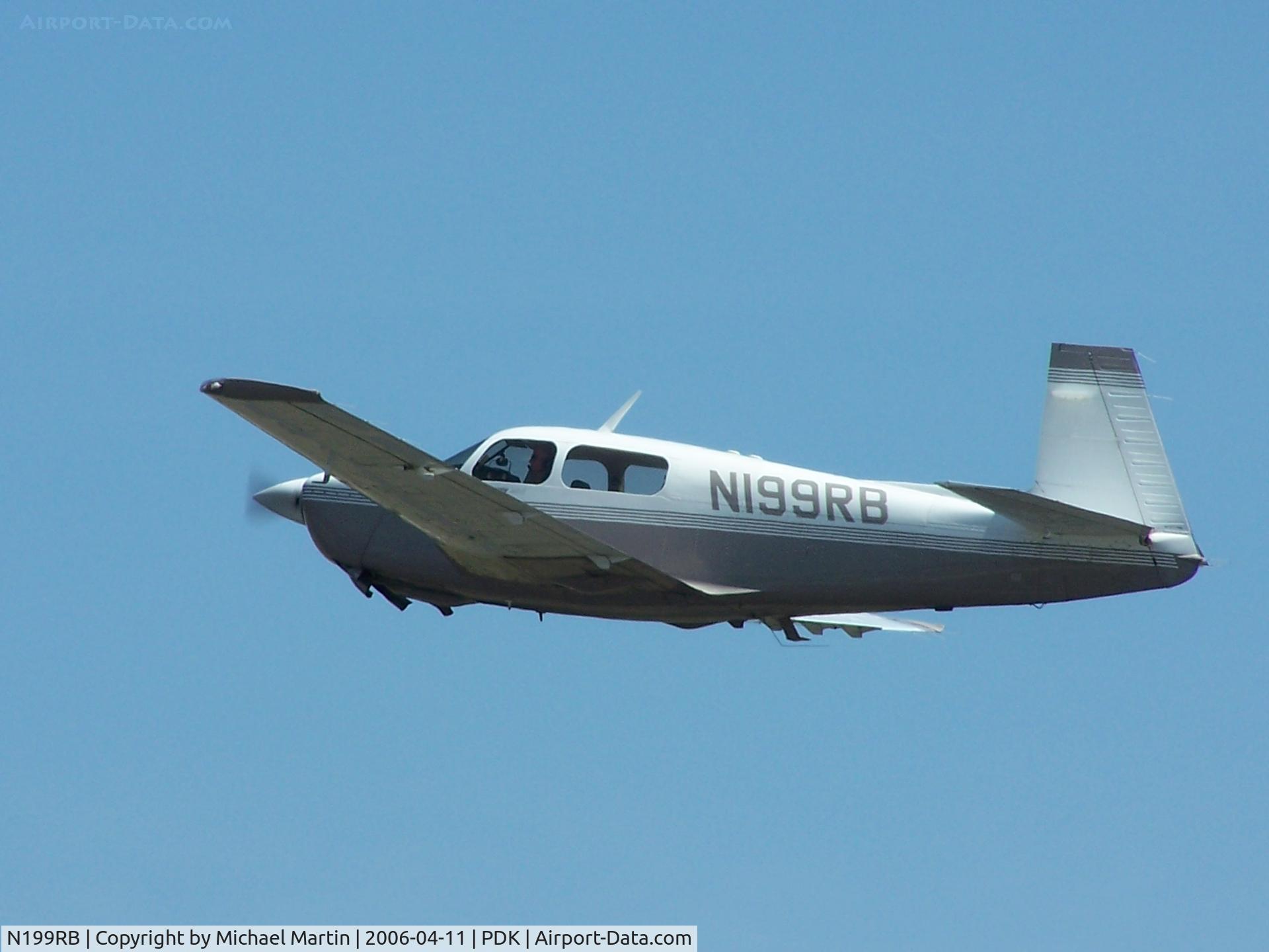 N199RB, 1991 Mooney M20J 201 C/N 24-3244, Gear up after take off from 2R