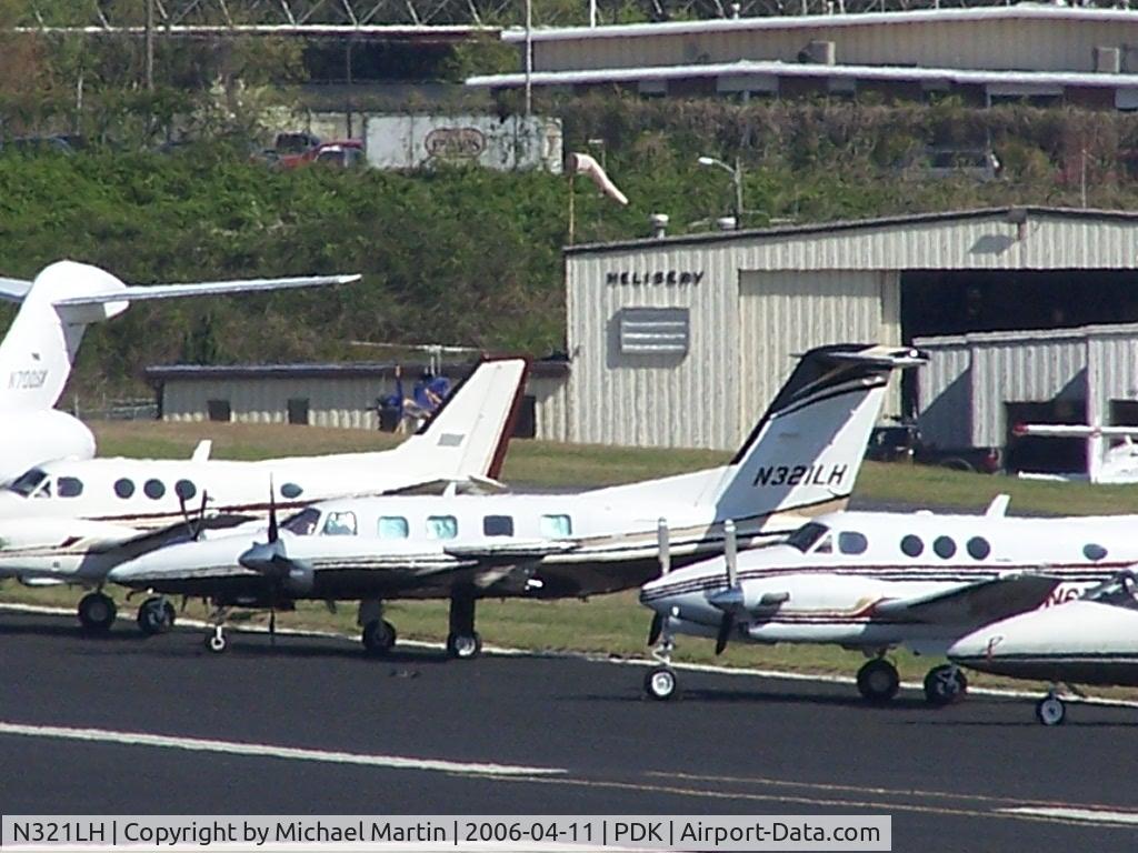 N321LH, 1985 Piper PA-42-1000 Cheyenne IV C/N 42-5527012, Long range photo - parked on 16/34 with others