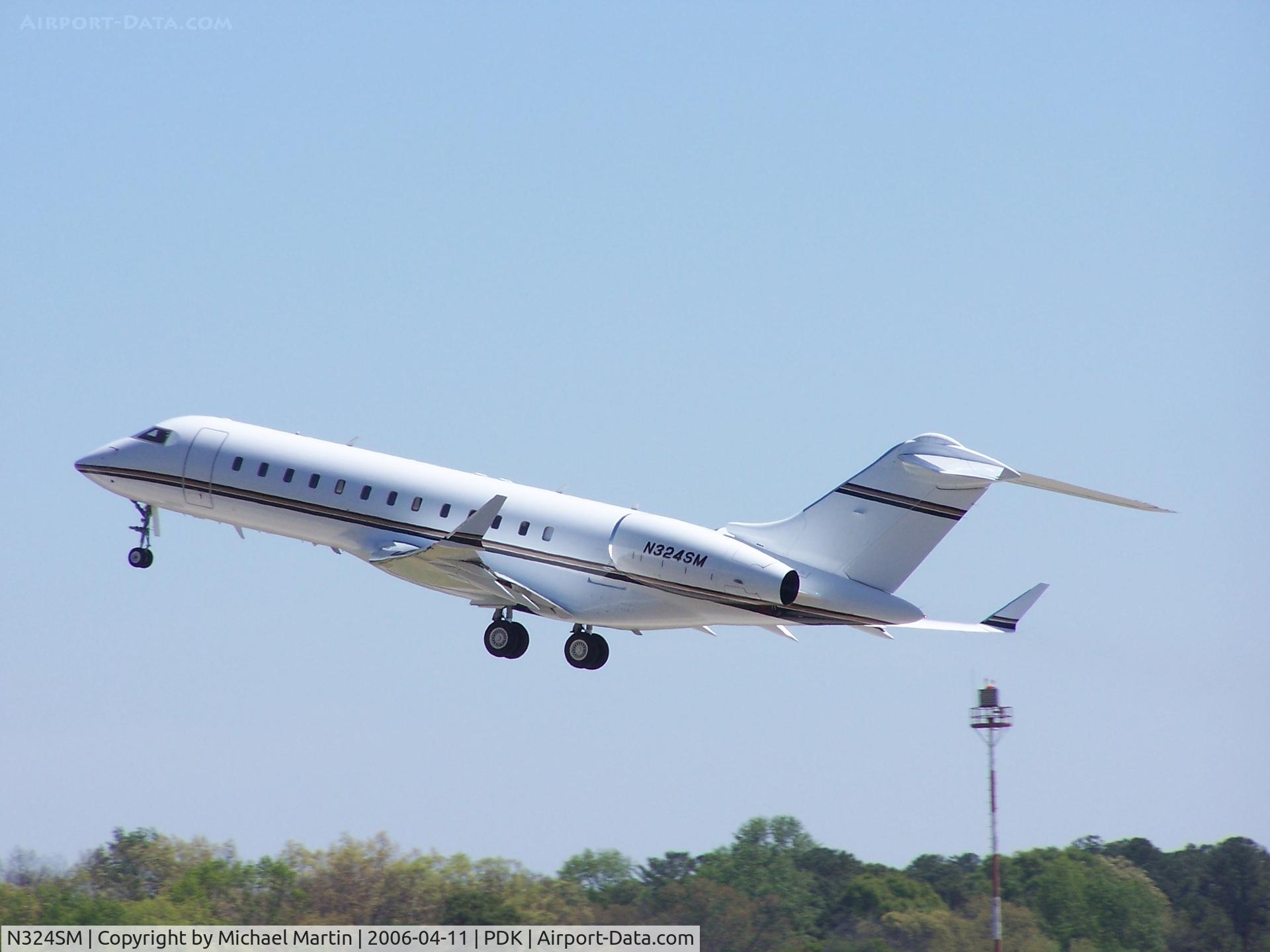 N324SM, 1999 Bombardier BD-700-1A10 Global Express C/N 9023, Departing PDK - Gear Up!