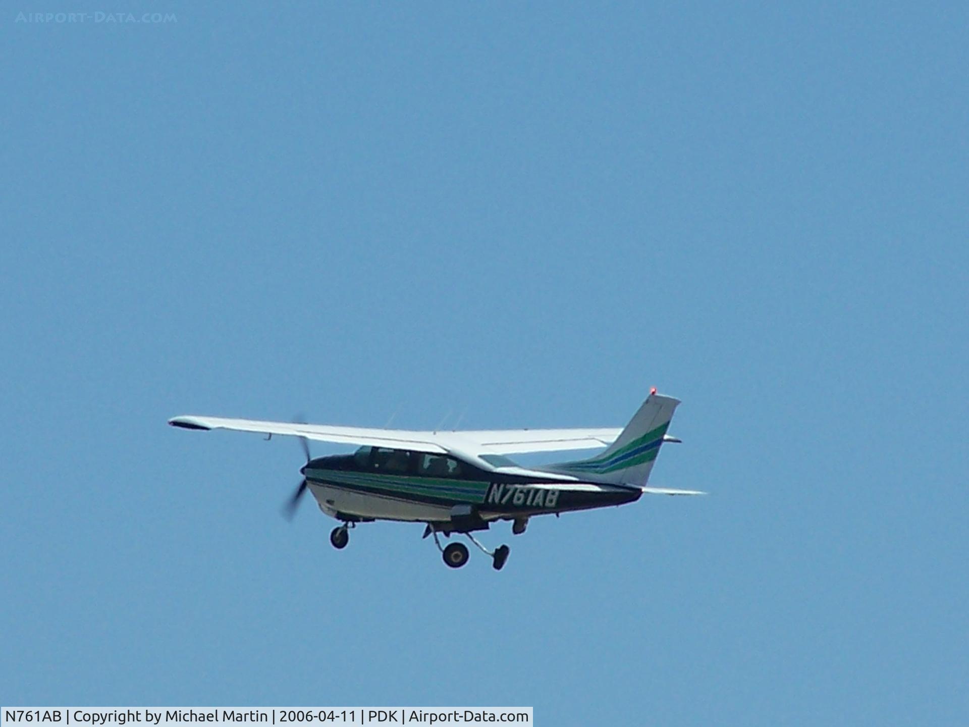 N761AB, 1977 Cessna 210M Centurion C/N 21062092, Departing PDK - Gear Up!