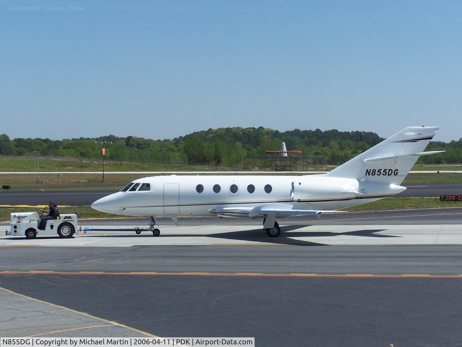 N855DG, 2006 Dassault Falcon 2000EX C/N 97, Being towed to parking at Epps Air Service