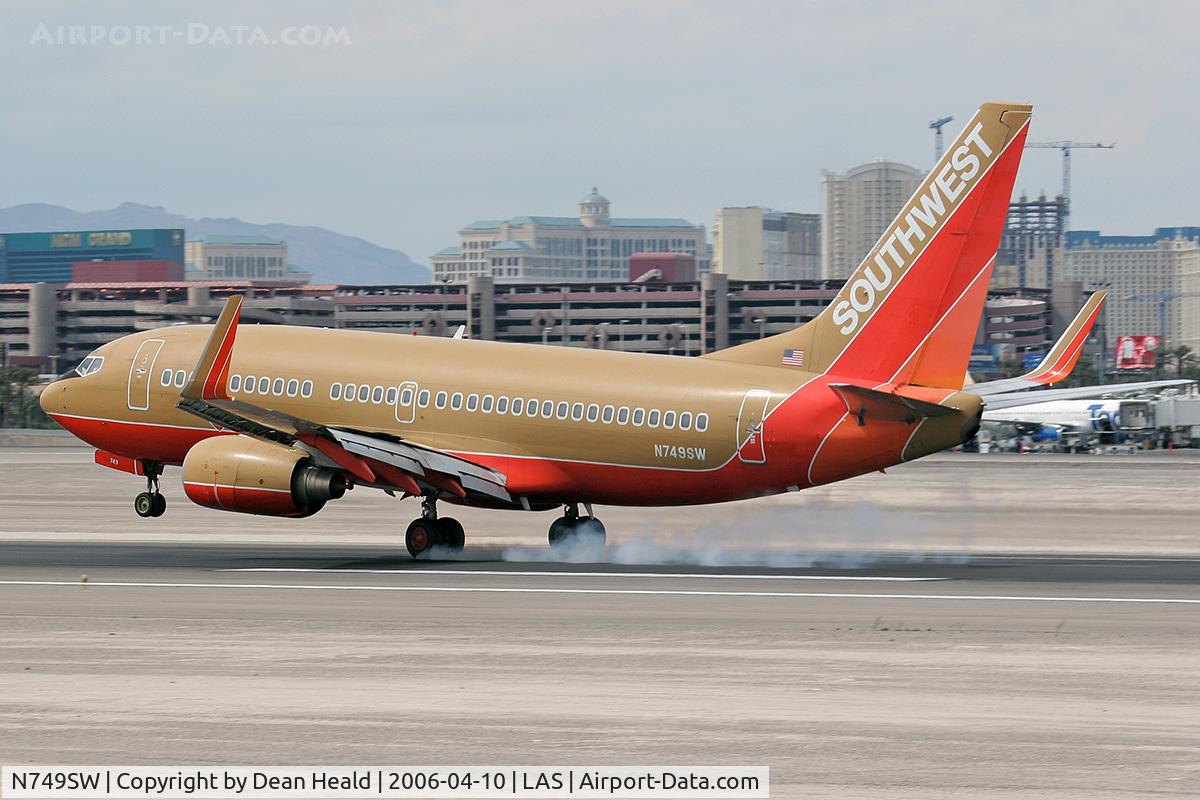 N749SW, 1999 Boeing 737-7H4 C/N 29801, Southwest N749SW - 1999 Boeing 737-7H4 (FLT SWA1358) touching down on RWY 25L, concluding a 41-minute flight from Phoenix Sky Harbor Int'l (KPHX) - Phoenix, Arizona.