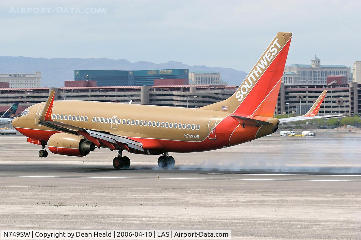 N749SW, 1999 Boeing 737-7H4 C/N 29801, Southwest N749SW - 1999 Boeing 737-7H4 (FLT SWA1358) touching down on RWY 25L, concluding a 41-minute flight from Phoenix Sky Harbor Int'l (KPHX) - Phoenix, Arizona.