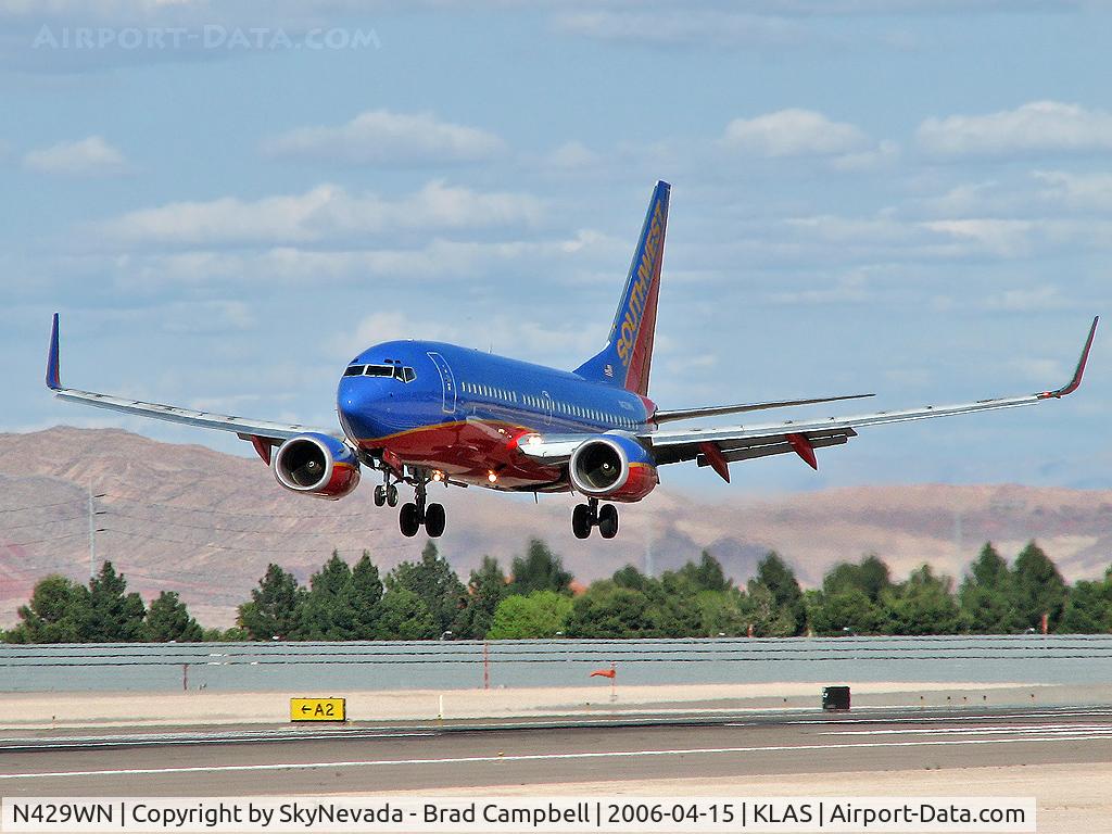 N429WN, 2002 Boeing 737-7H4 C/N 33658, Southwest Airlines / 2002 Boeing 737-7H4 / You can see the right-side engine reflecting off the body! Check it out with a magnifying glass. Cool...!
