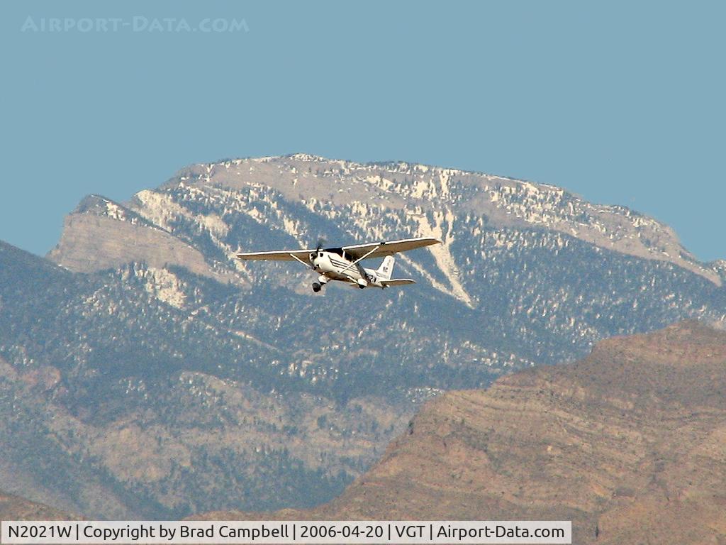 N2021W, 2003 Cessna 172S C/N 172S9321, Elite Door & Window / 2003 Cessna 172S (Skyhawk) with 'Mummy' Mtn in background.