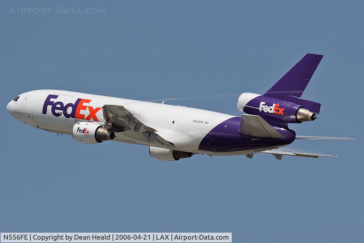 N556FE, 1972 McDonnell Douglas MD-10-10F C/N 46710, FedEx N556FE (MD-10-10F) - FLT FDX3019 - climbing out from RWY 25R enroute to Chicago Ohare Int'l (KORD), Illinois. Note the condensation trails from the wingtips and condensation over the wings.