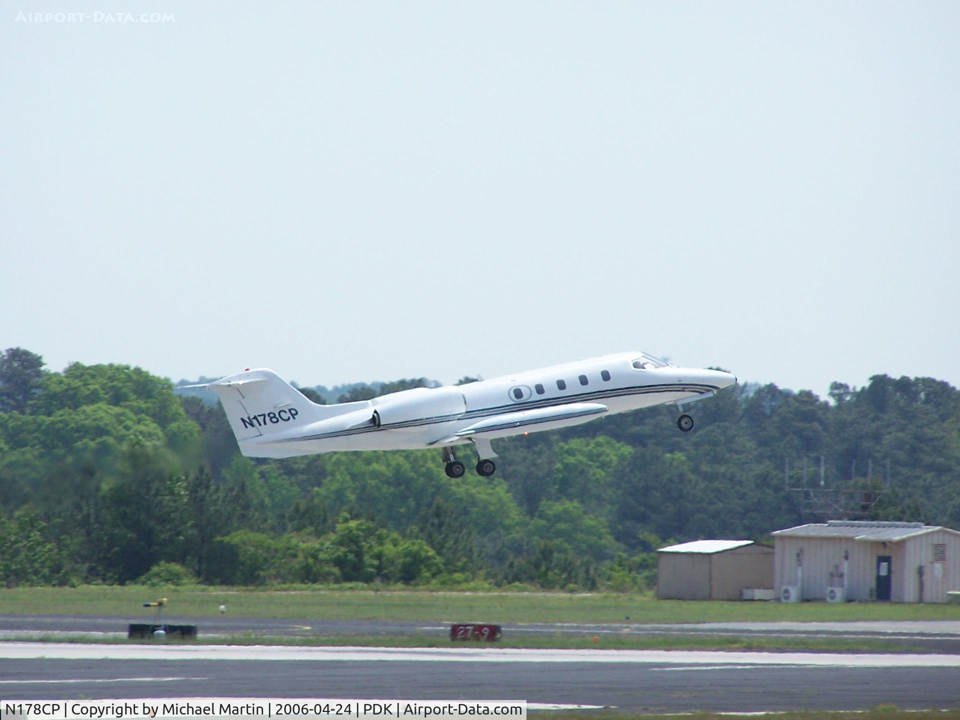 N178CP, 1975 Gates Learjet 35 C/N 005, Departing PDK - Starting to rotate gear.