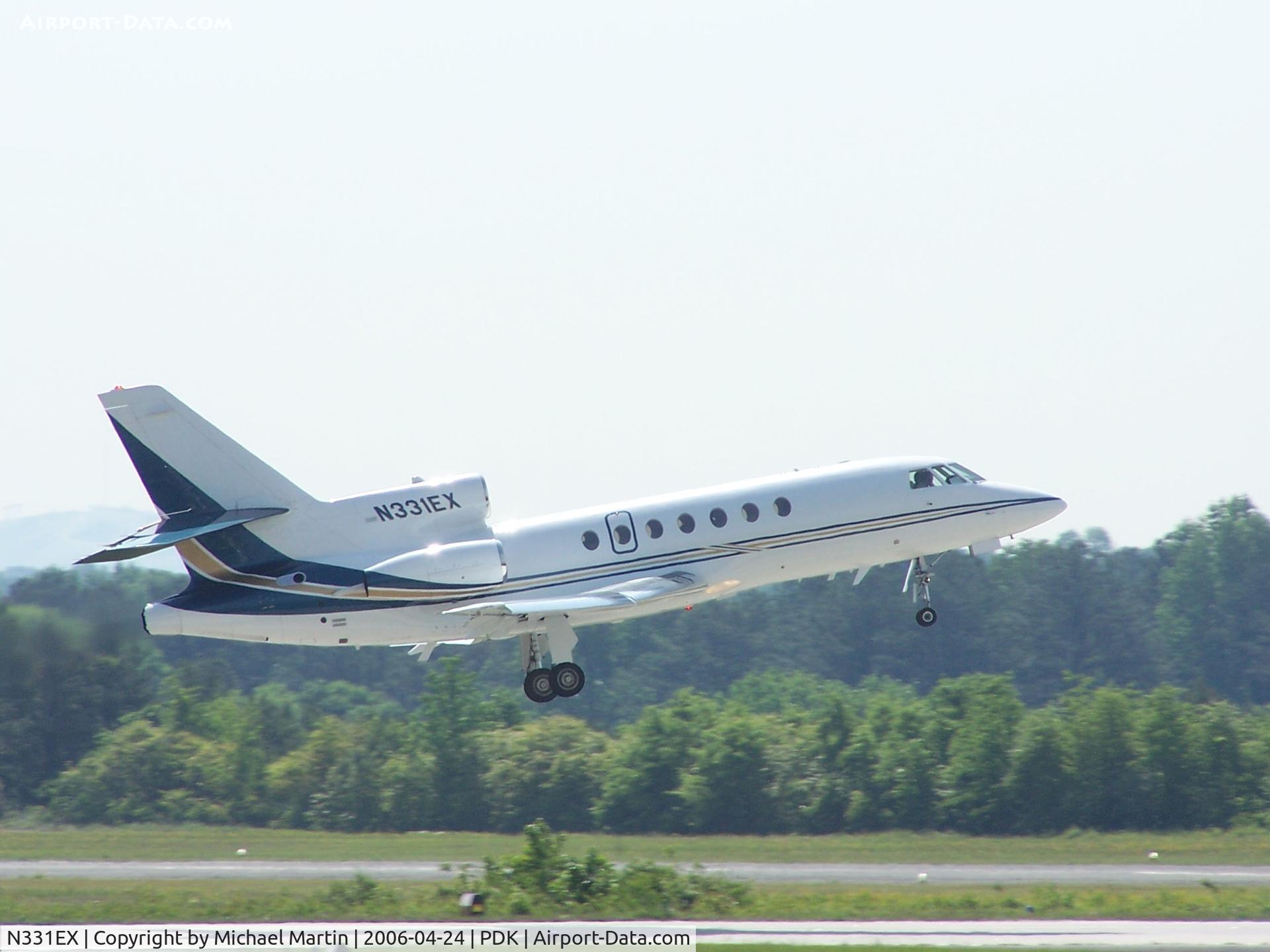 N331EX, 2003 Dassault Falcon 50 C/N 331, Departing PDK - Starting to rotate gear.