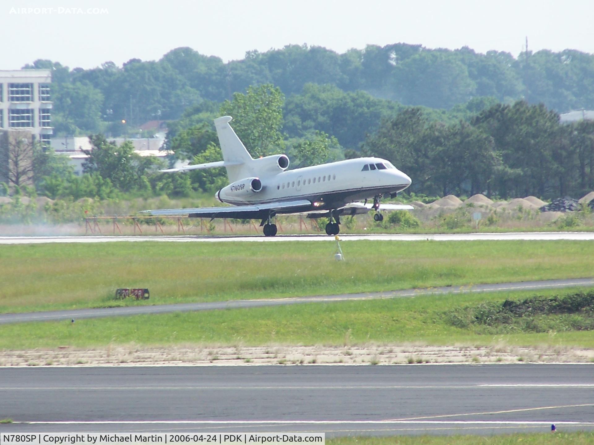 N780SP, 1991 Dassault Falcon 900 C/N 93, LANDING 20L - A little tire smoke