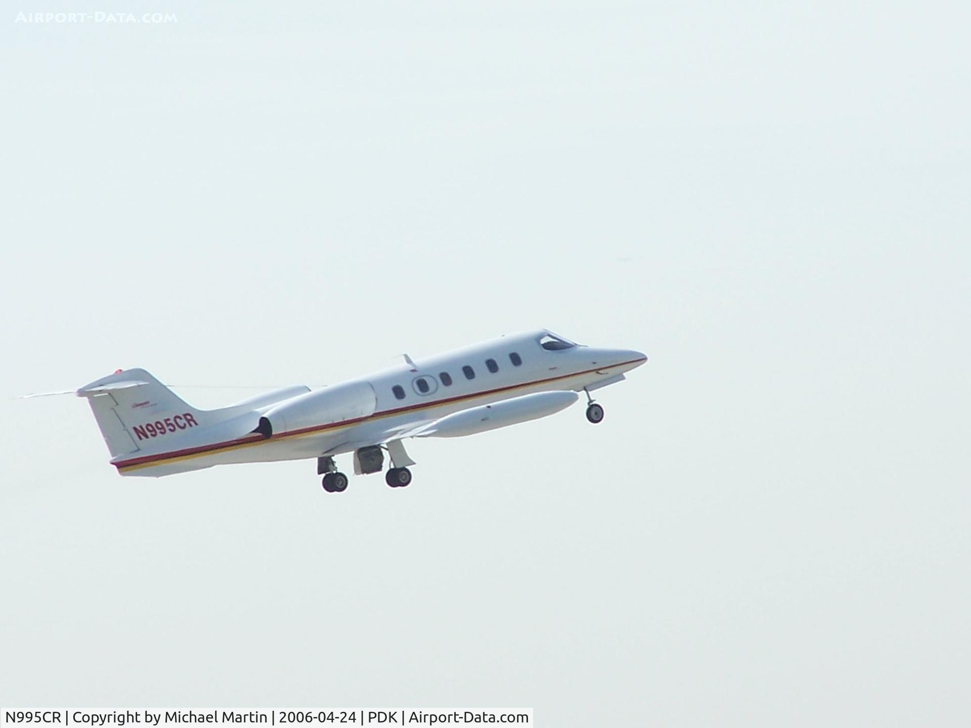N995CR, 1980 Gates Learjet 35A C/N 304, Departing PDK against a bright sun