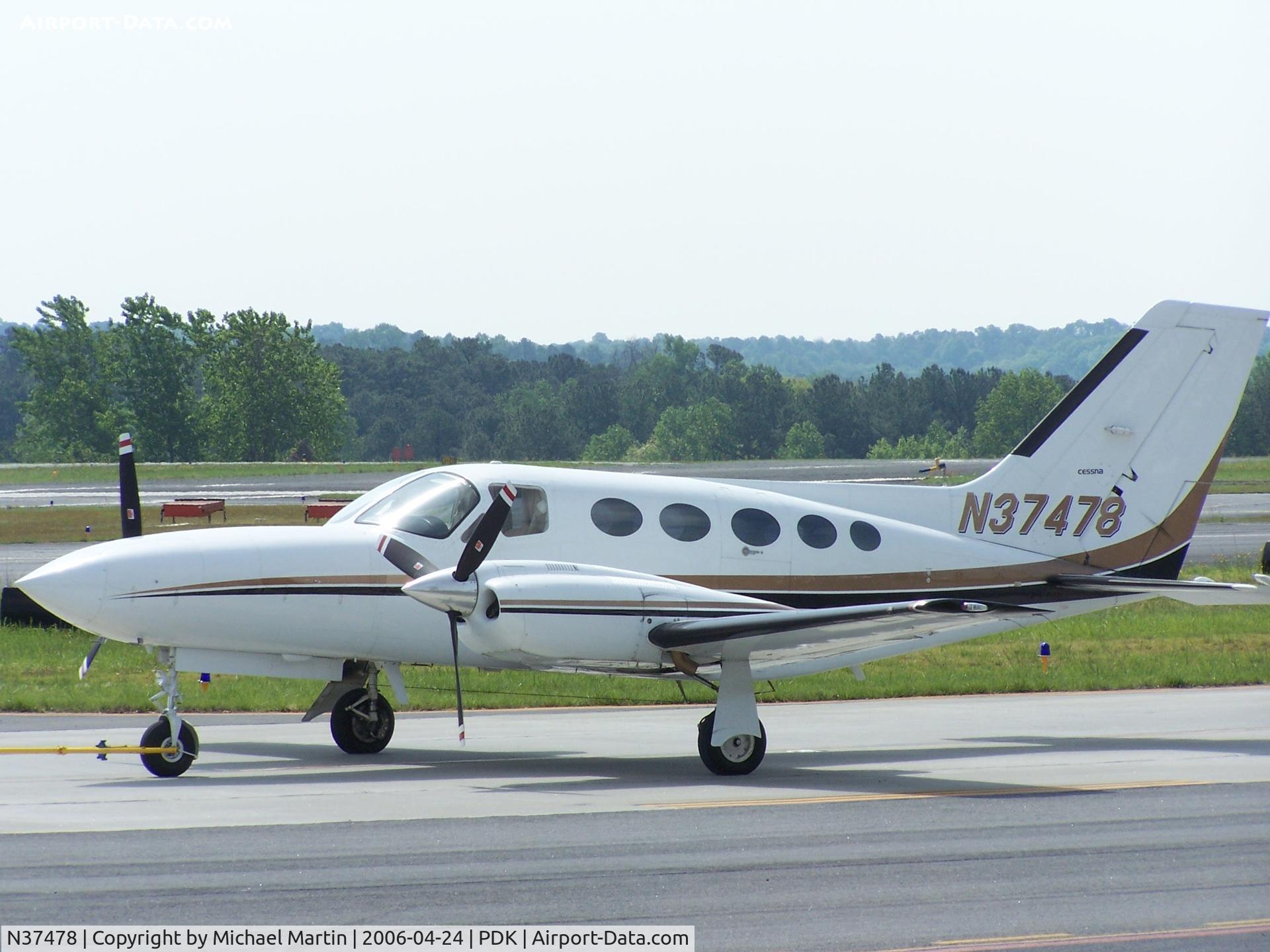 N37478, Cessna 421C Golden Eagle C/N 421C0415, Being towed to parking at Epps Air Service
