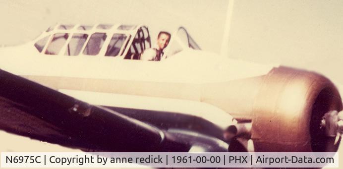 N6975C, 1958 North American AT-6G (SNJ-5) Texan C/N 51677, bob reid in flight 1961