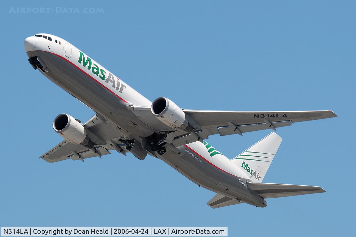 N314LA, 2001 Boeing 767-316F C/N 32573, Mas Air (Cargo) N314LA, apparently light, climbing out steeply from RWY 25L.
