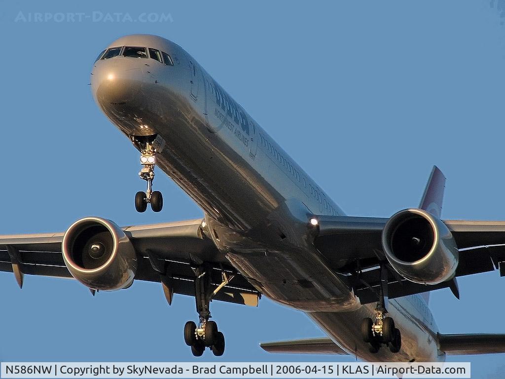 N586NW, 2002 Boeing 757-351 C/N 32987, Northwest Airlines / 2002 Boeing 757-351 / If you'll notice, you can see the pilot shading his eyes from the intense sunlight so often encountered here in Vegas when headed West during the late evening hours.