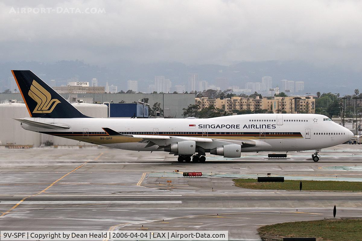 9V-SPF, 1995 Boeing 747-412 C/N 27071, Singapore Airlines 9V-SPF starting her takeoff roll on RWY 7L on a wet day.