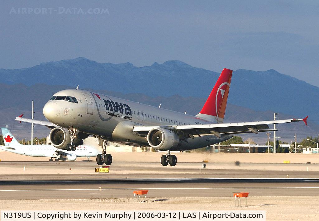 N319US, 1991 Airbus A320-211 C/N 208, Touching down in the early evening
