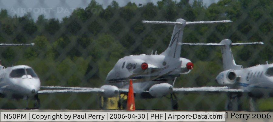 N50PM, 2003 Raytheon Aircraft Company 390 C/N RB-80, Netjets hanging out at KPHF, with the other bizjets