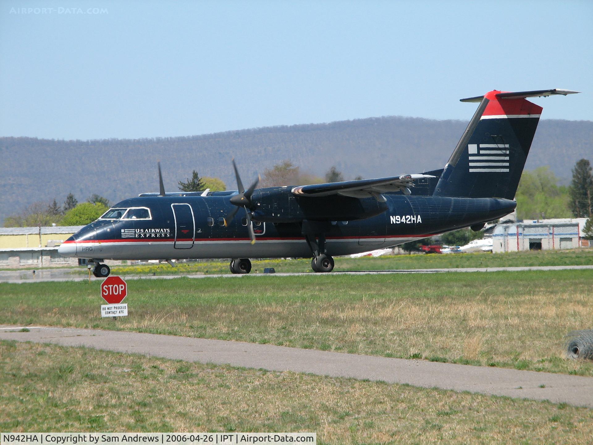 N942HA, 1989 De Havilland Canada DHC-8-102 Dash 8 Dash 8 C/N 163, Stopped on Rwy27.  Who's the guy with the camera?