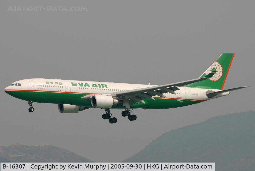 B-16307, 2004 Airbus A330-203 C/N 634, EVA A.330 drifting into Hong Kong on a hazy day.