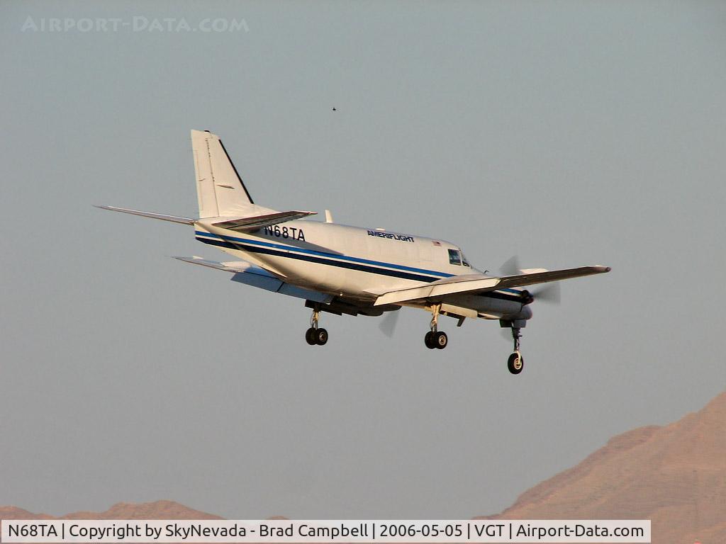 N68TA, 1982 Beech C99 Airliner C/N U-177, Ameriflight / 1982 Beech C-99 / The 'C' stands for 'Commuter' but in this case it should be 'Cargo' - that's what Ameriflight does. And, I don't know what the object is above plane. Probably something out of Nellis to the east.