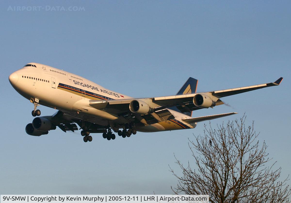 9V-SMW, 1994 Boeing 747-412 C/N 27178, A lone magpie watches the big birds go by.