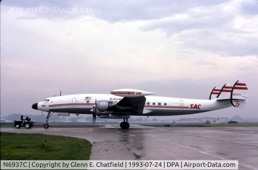 N6937C, 1957 Lockheed L-1049H-82 Super Constellation C/N 4830, Towing out on an early, wet morning