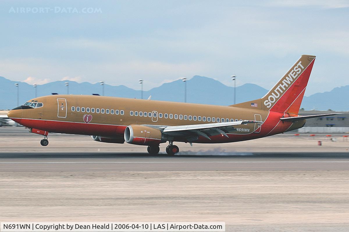 N691WN, 1988 Boeing 737-3G7 C/N 23781, Southwest Airlines N691WN (FLT SWA1581) touching down on RWY 25L after a 46-minute flight from Los Angeles Int'l (KLAX).