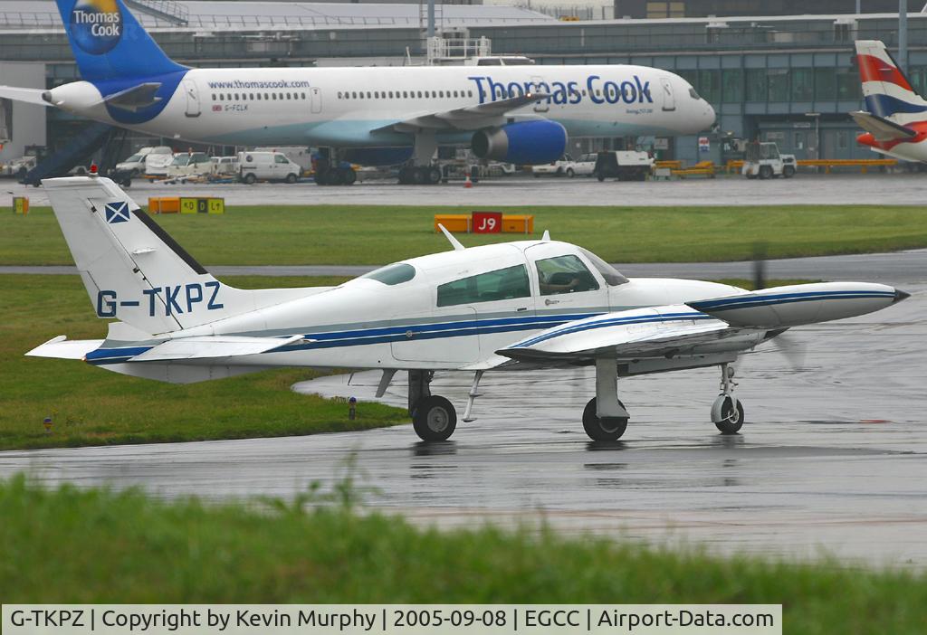 G-TKPZ, 1977 Cessna 310R C/N 310R-1225, Leaving the exec ramp on a very damp day.