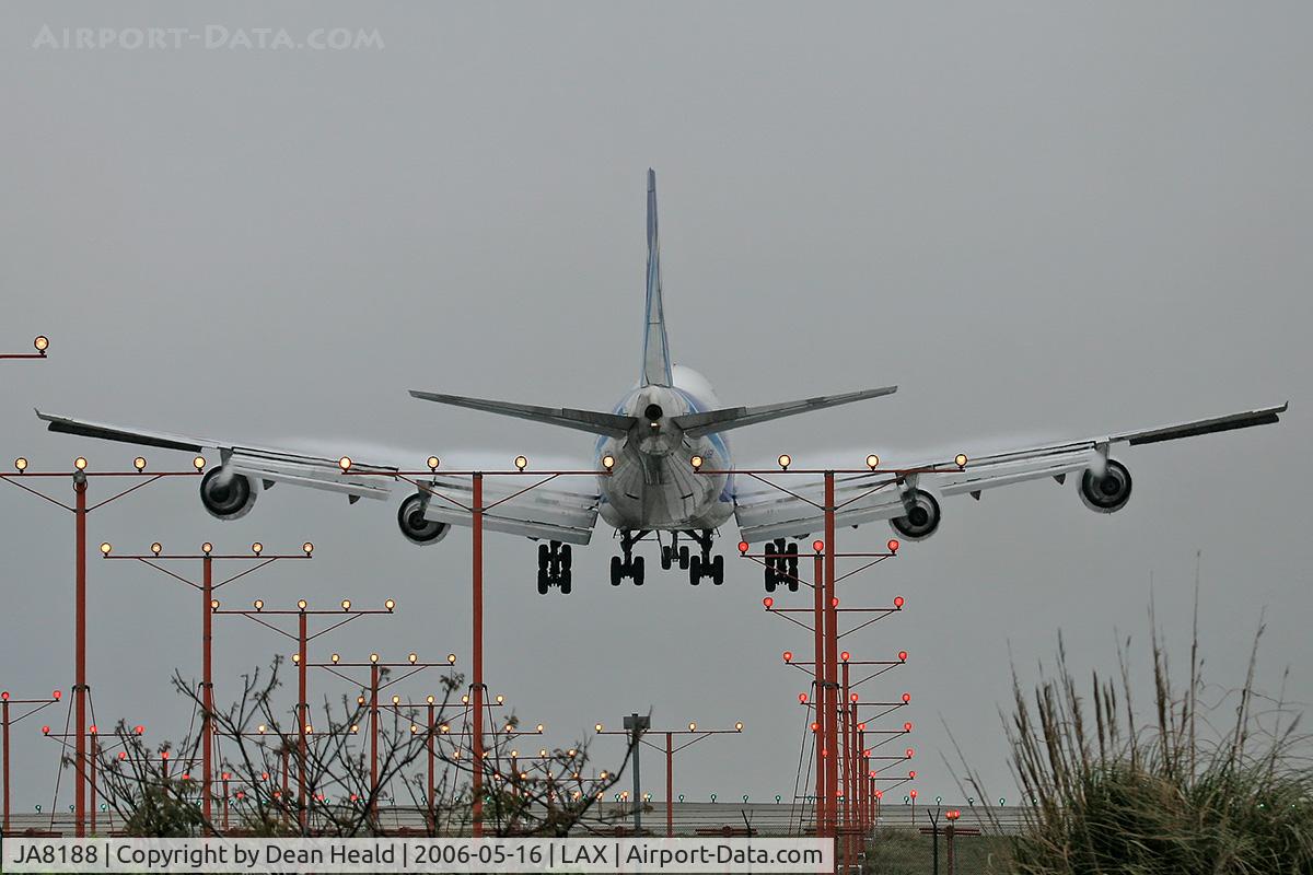 JA8188, 1987 Boeing 747-281F C/N 23919, Nippon Cargo Airlines (NCA) JA8188 (FLT NCA152) from San Francisco Int'l (KSFO) seconds from touchdown on RWY 24R on an overcast evening.  Note the condensation on the upper surface of the wings.