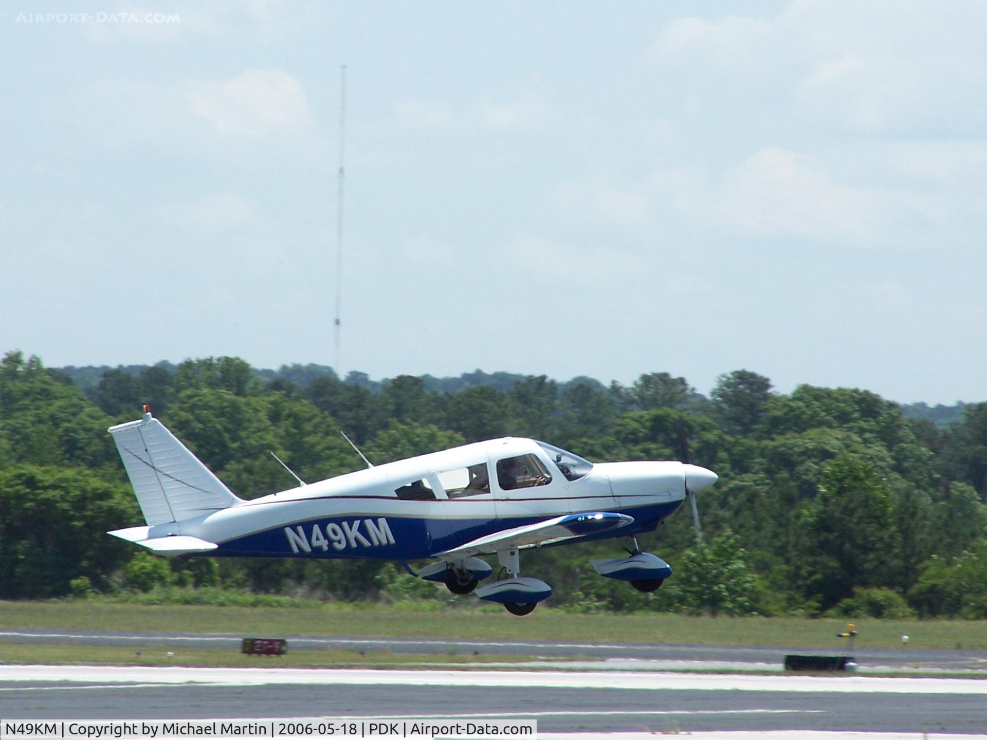 N49KM, 1969 Piper PA-28-180 C/N 28-5729, Departing 20R
