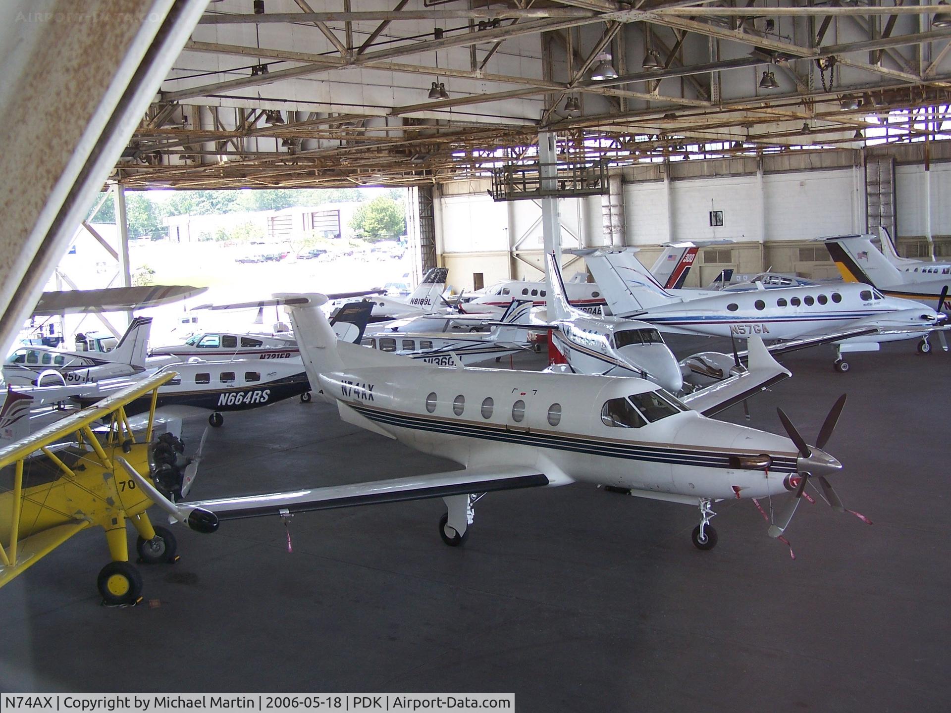 N74AX, 1996 Pilatus PC-12 C/N 149, In Epps Air Service hanger with various other aircraft.