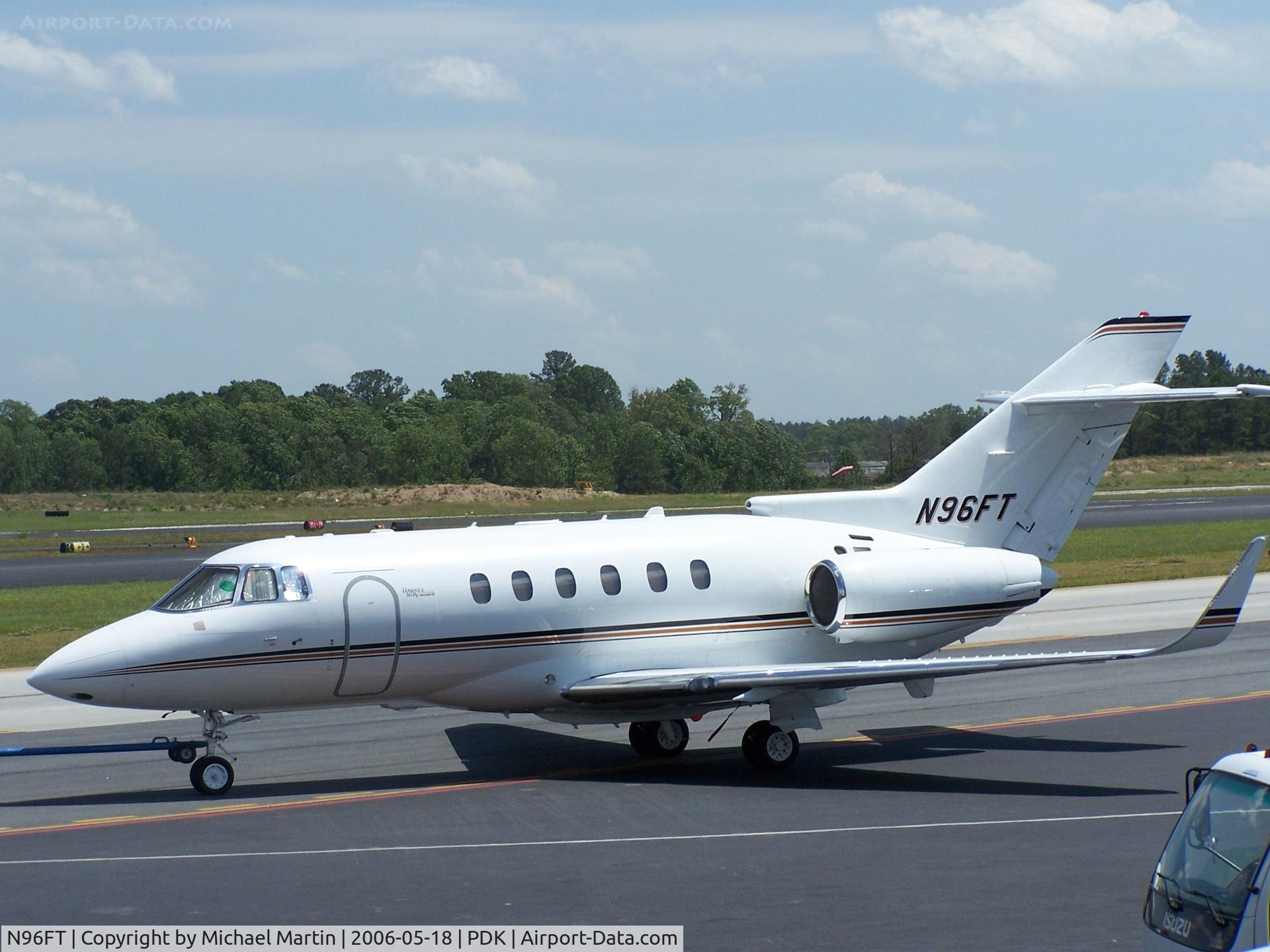 N96FT, 2002 Raytheon Hawker 800XP C/N 258568, Being towed to parking at Mercury Air Center