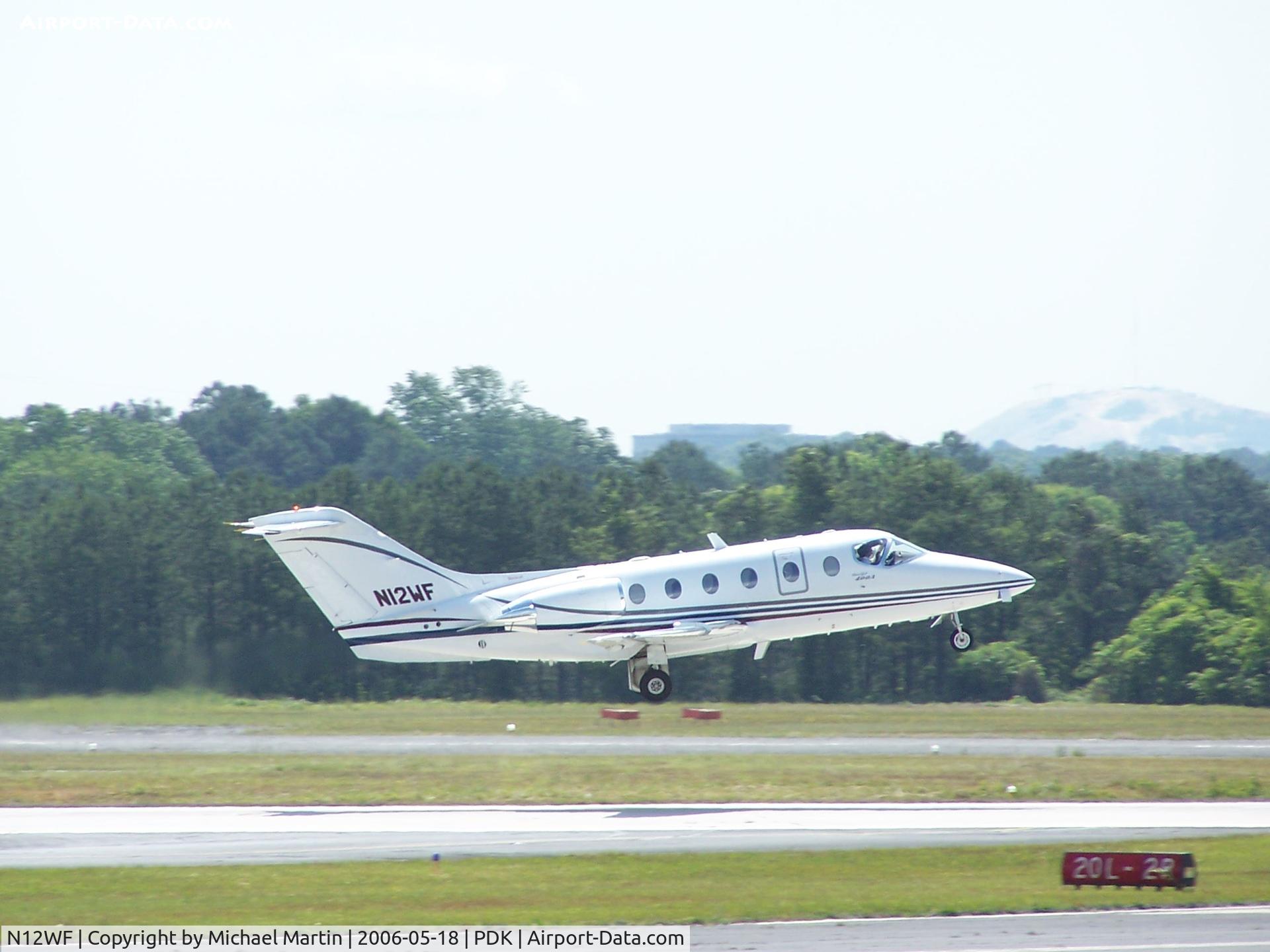 N12WF, 1999 Raytheon BeechJet 400A C/N RK-228, Departing 20L