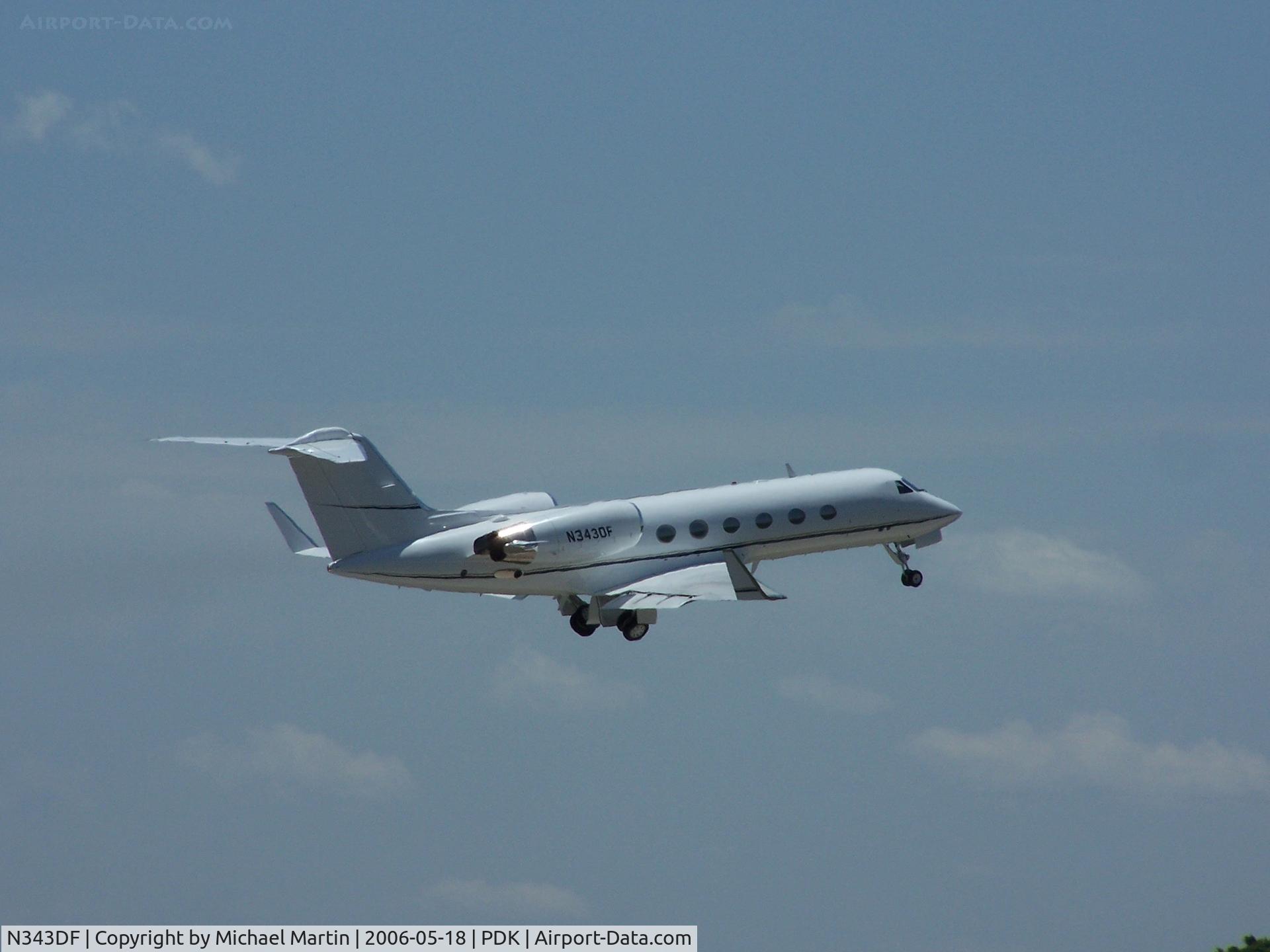 N343DF, 1986 Gulfstream Aerospace G-1159A Gulfstream III C/N 483, Departing PDK - Starting to rotate gear.