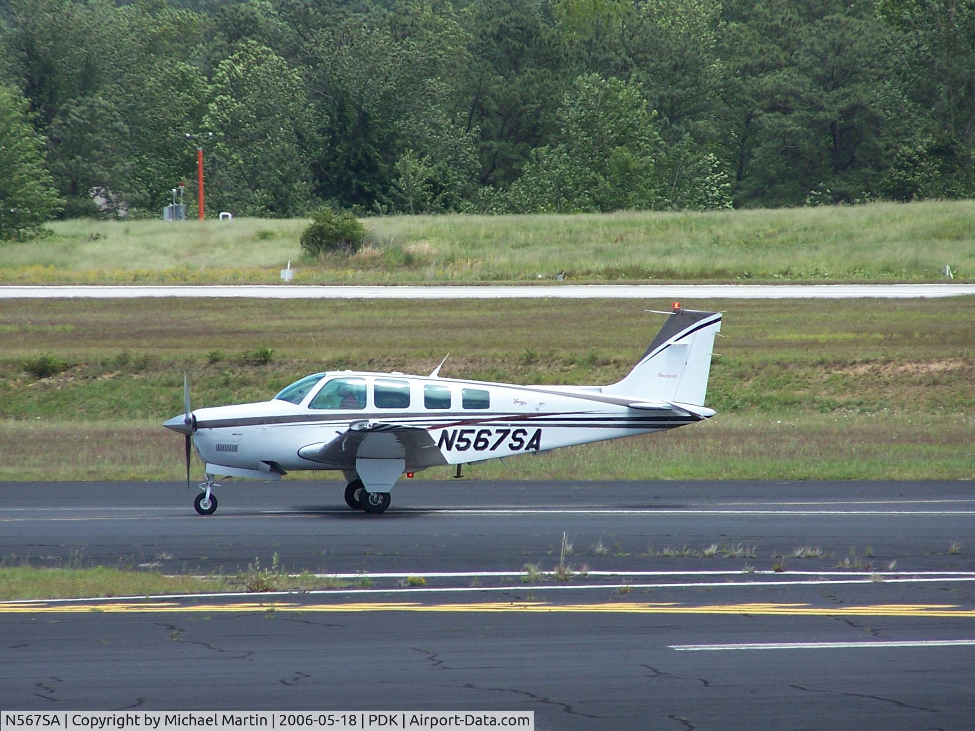 N567SA, 1999 Raytheon Aircraft Company A36 Bonanza C/N E-3278, Taxing to Epps Air Service