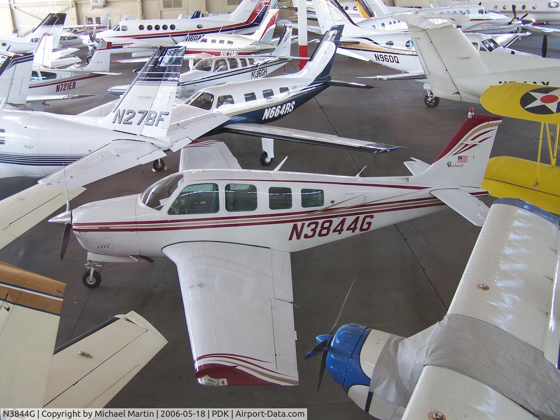 N3844G, 1981 Beech A36 Bonanza 36 C/N E-1826, In Epps Air Service hanger with various other aircraft.