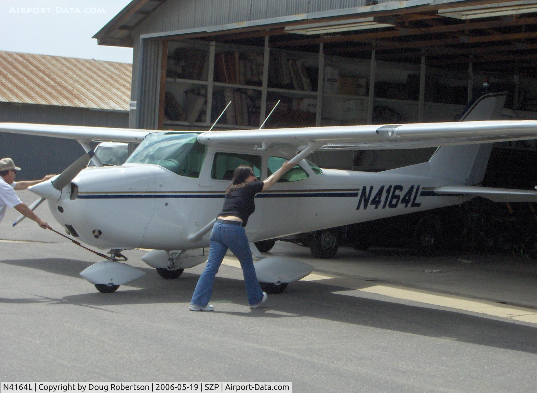 N4164L, 1966 Cessna 172G C/N 17254233, 1966 Cessna 172G, Continental O-300 145 Hp, pushing back in the hangar