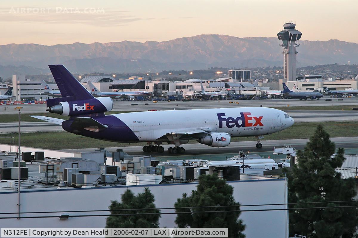 N312FE, 1987 McDonnell Douglas MD-10-30F C/N 48300, FedEx N312FE taxiing to the cargo terminal after arrival on RWY 25L on a clear February evening.