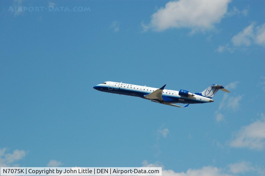 N707SK, 1999 Bombardier CRJ-701ER (CL-600-2C10) Regional Jet C/N 10003, United Express CLJ Take-Off at DIA
