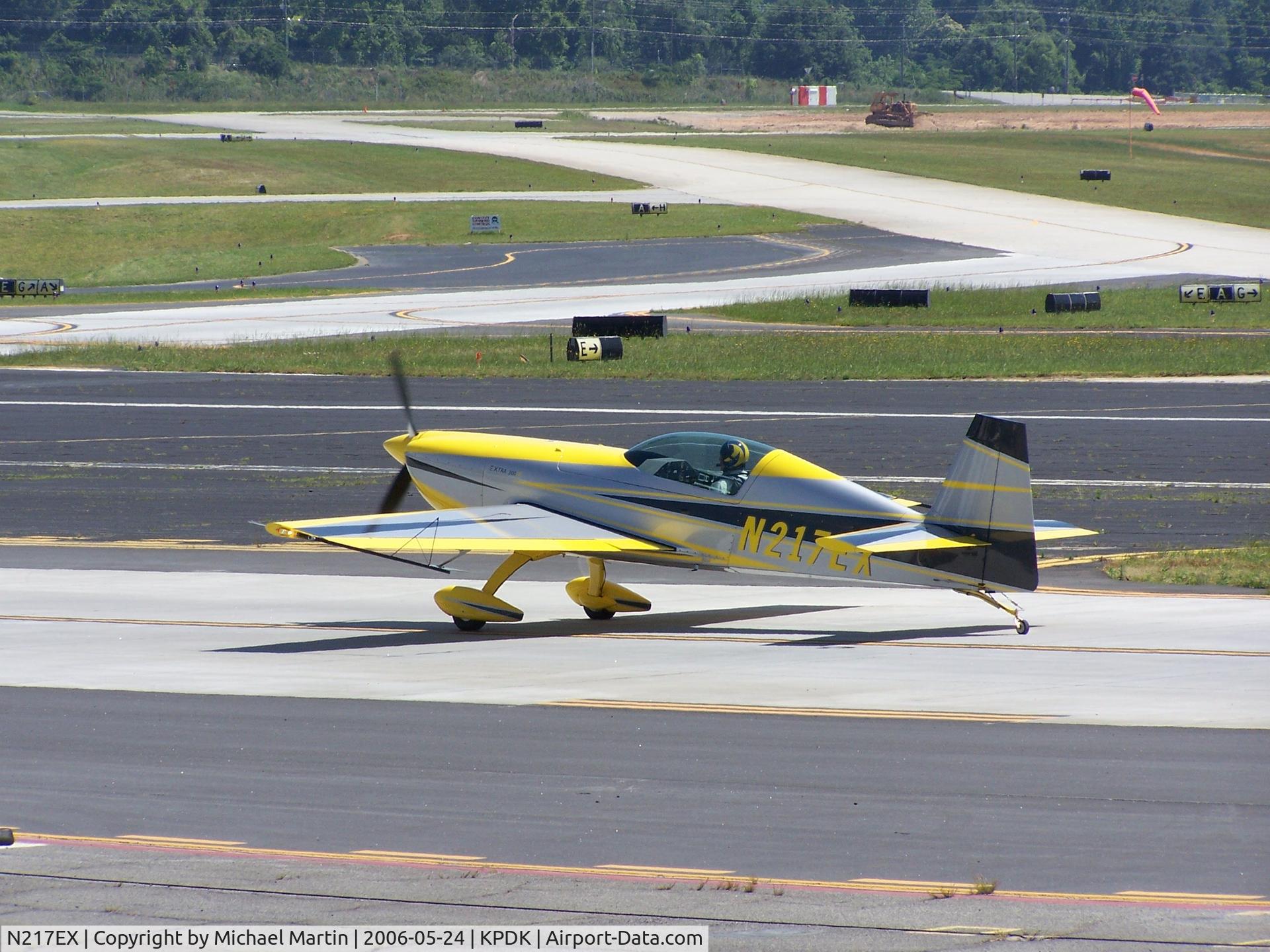 N217EX, 2005 Extra EA-300/L C/N 1217, Taxing to Epps - Nice Helmet!