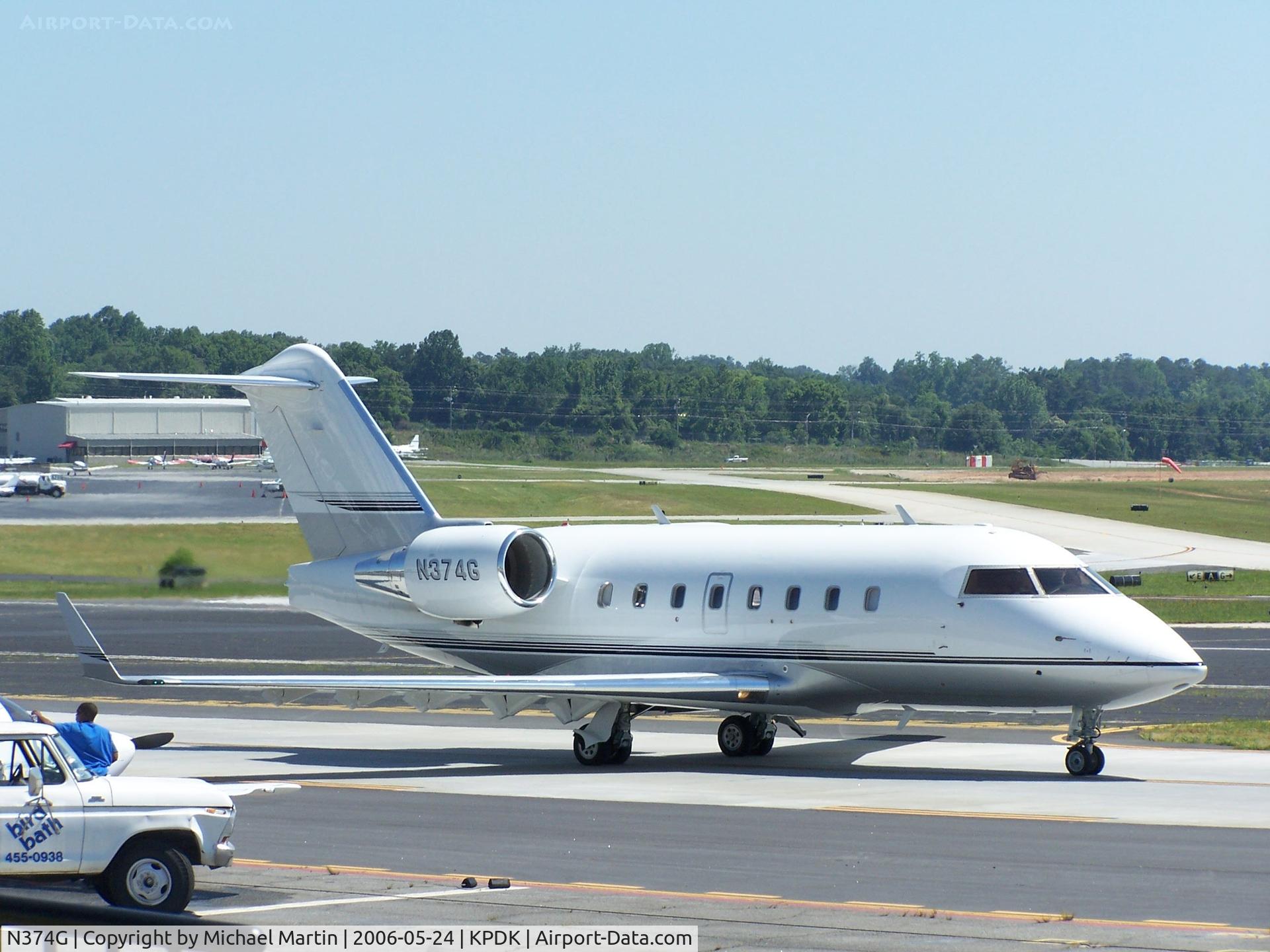 N374G, 2000 Canadair Challenger 604 (CL-600-2B16) C/N 5368, Taxing past Mercury Air Service