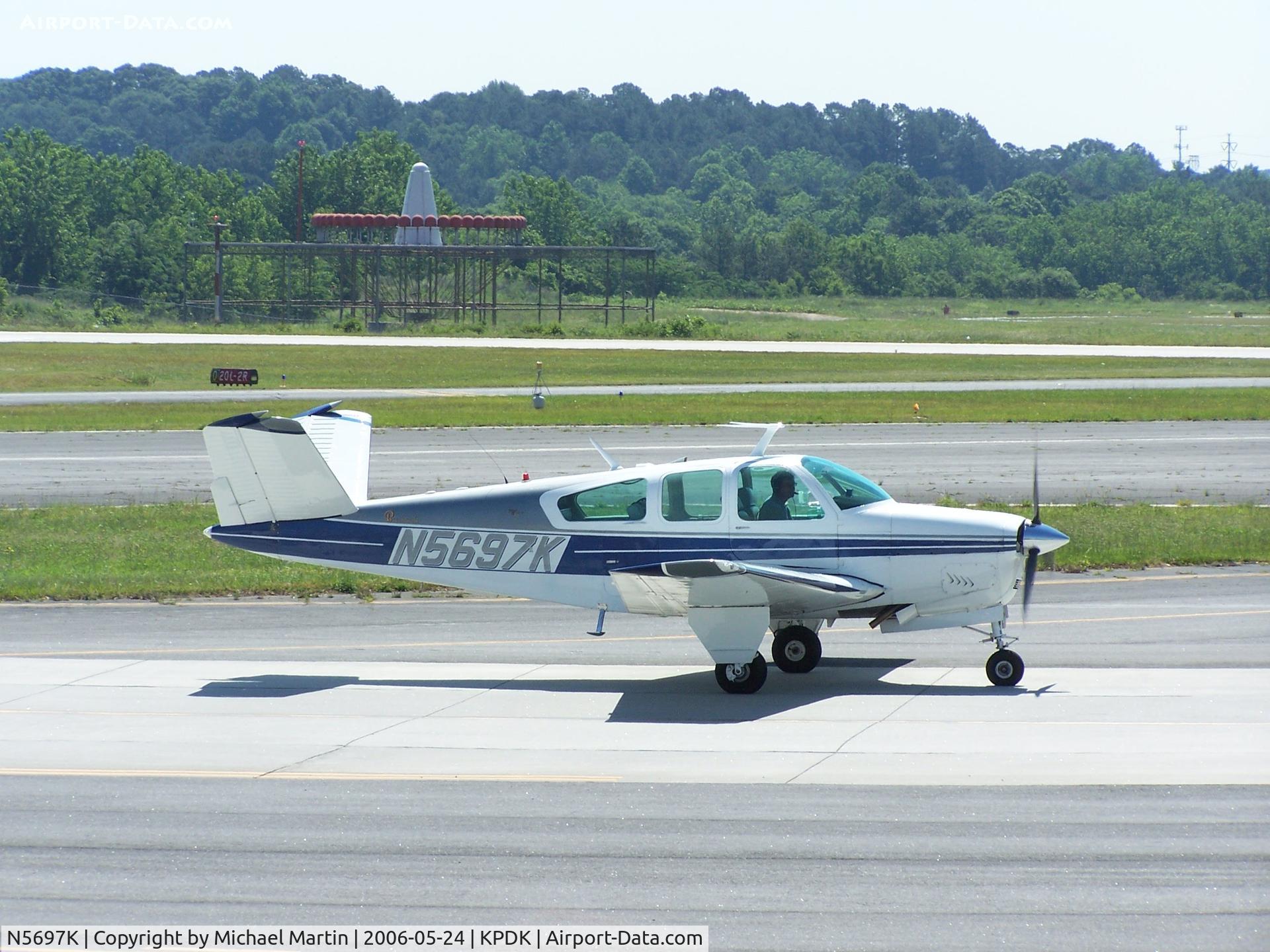 N5697K, 1964 Beech S35 Bonanza C/N D-7620, Taxing to Runway 2L