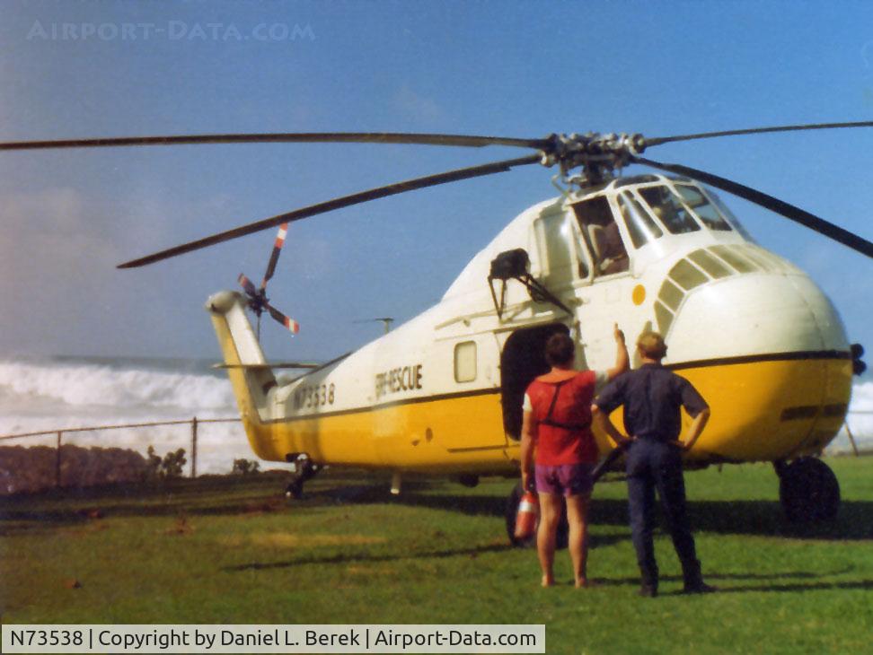 N73538, 1955 Sikorsky H-34 C/N 554490, A mighty Sikorsky H-34 rescue chopper stands by on a day of particularly rough surf at Waiameia, on Oahu's western coast, in 1974.